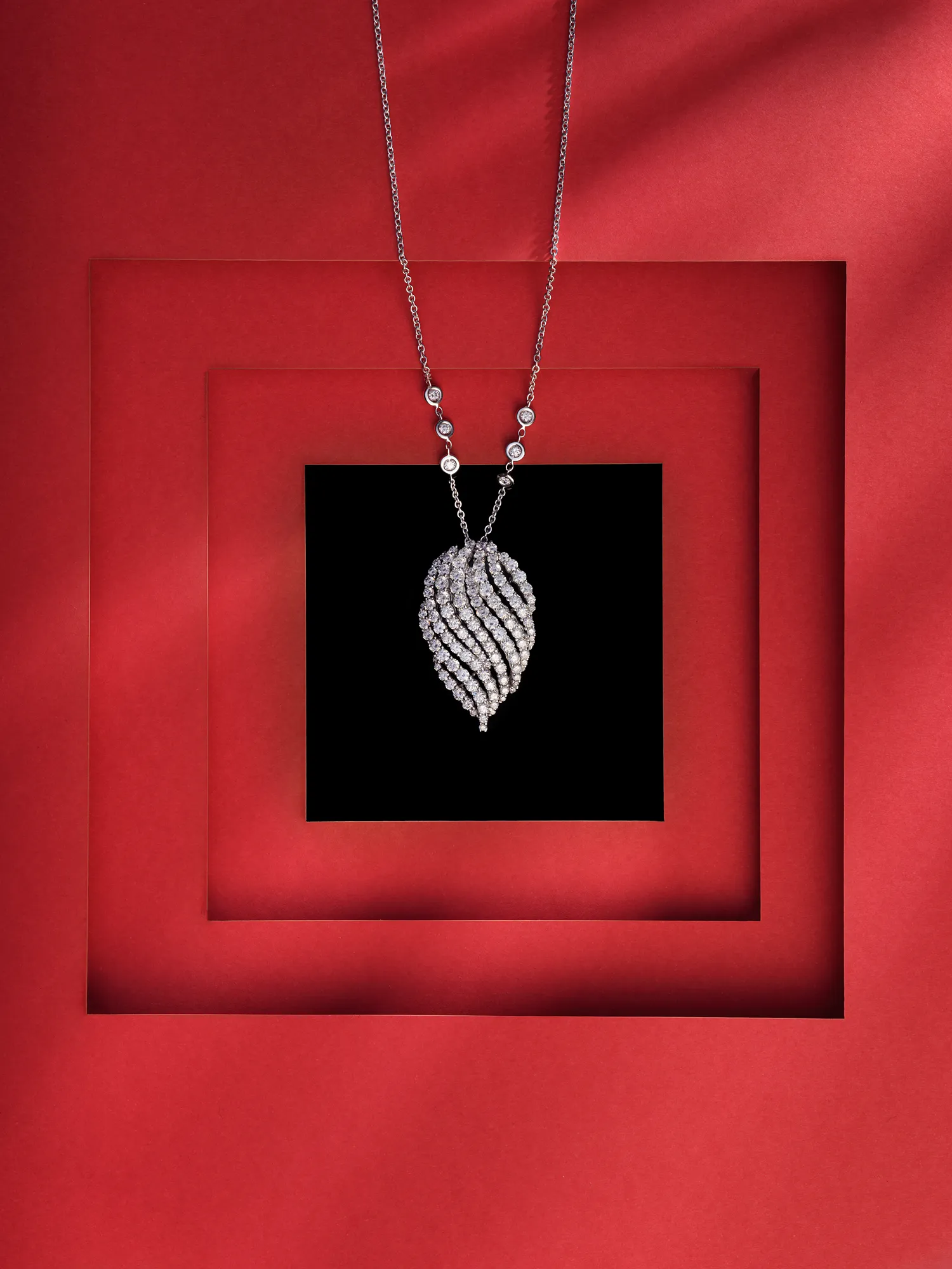 Frank Zampa Diamond Jewellery Product Red Background — product photography by Stephen Galea, Malta